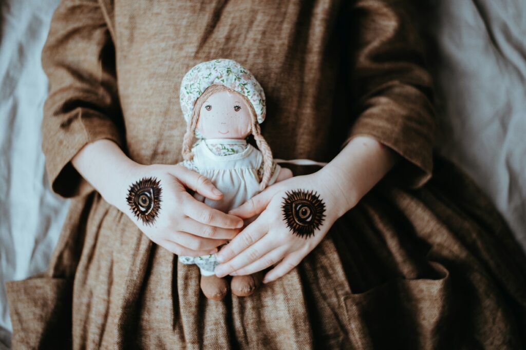 a person holding a stuffed animal